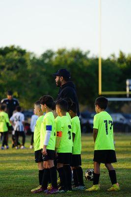 Coach Randy stands at the helm of our U8 soccer team, bringing a wealth of knowledge, infectious enthusiasm, and a deep love for the game.