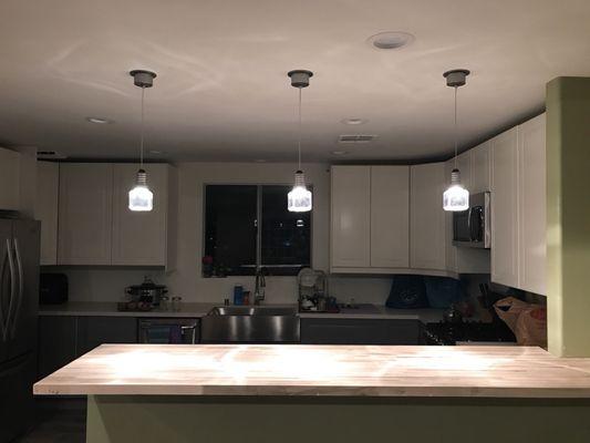 The 3 hanging lights over the butcher block was what Abe suggested. LOVE!