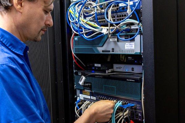 Mike (Senior Engineer) in Microland's Data Center.