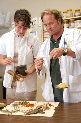 Student Intern and Faculty Practitioner Weighing Herbs