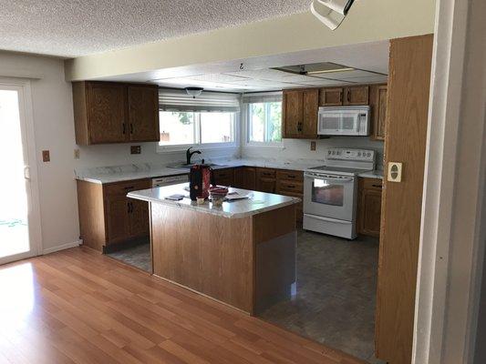 Kitchen cabinets painted and floors