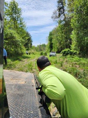 Recovering a truck that was stuck in a swampy area.