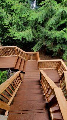 Trex Enhance Decking with Cedar Deck Railing and Matching deck board top cap for the railing.