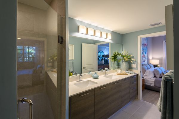 Bathroom with stylish lighting and glass door shower