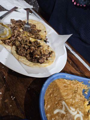 Carne Asada tacos with refried beans