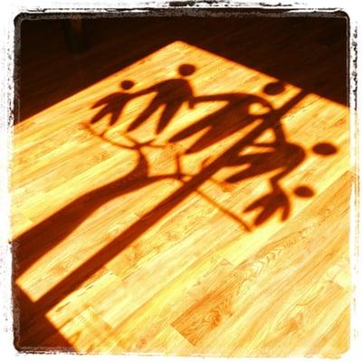 The shadow of our logo on our floors.