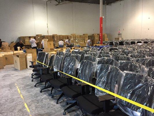 C-Serv Team building 1277 office chairs for Just in time delivery to a customer in North Austin