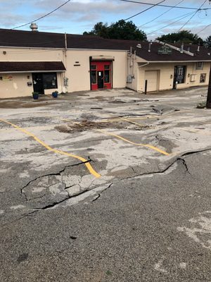 Parking lot damage from storm.