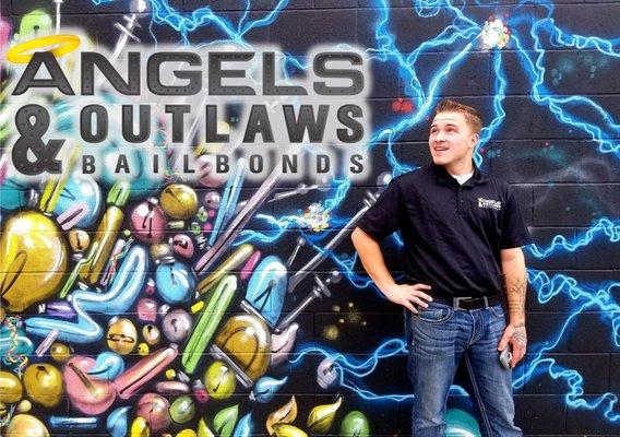 Tristen Trego, Owner of Angels & Outlaws Bail Bonds in Pueblo, CO. (Mural Artwork by Mat Refic)