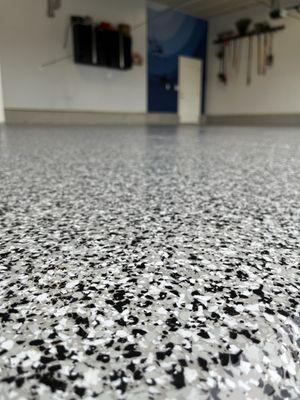 Add strength and value with a beautiful salt and pepper flake epoxy garage coating.