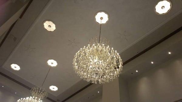 Lovely chandeliers adorn the ceilings