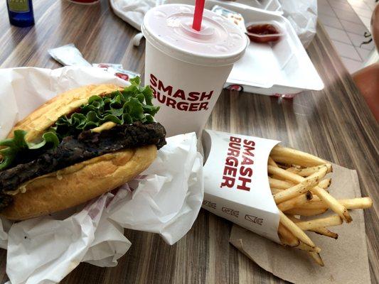 Veggie burger, smash fries, and water cup