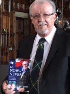 Dee showing his new book while on a trip to Scotland and Ireland.