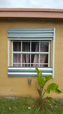 Vertical metal hurricane shutters