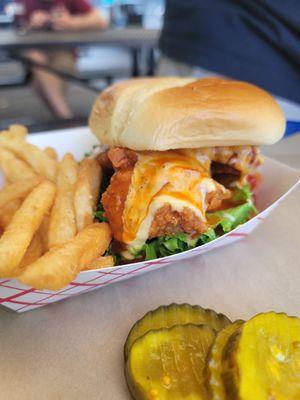 Mother Clucker - Hand battered fresh fried chicken w/ cheese, Lettuce, mayo, & pickles with extra spicy ghost pepper hot garlic sauce