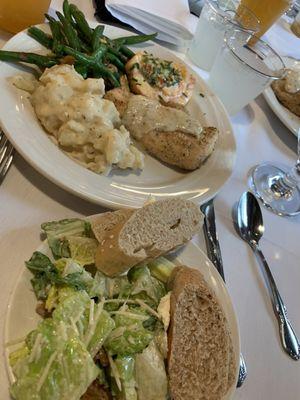 Caesar salad, bread, spinach artichoke salmon, parmesan chicken, scalloped potatoes, green beans almondine