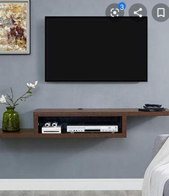 Tv and accessories mounted to wall