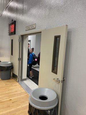 Inside the gym looking at doors to restroom area