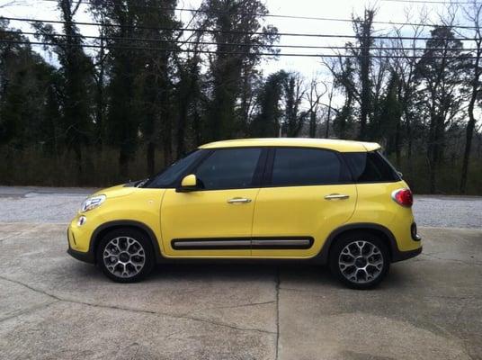 Yellow Fiat with window tint