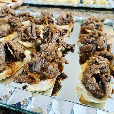 Tri-tip crostini with red wine grilled onions