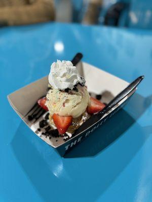 Vegan waffle with vegan birthday cake ice cream, strawberries, Oreos and whipped cream