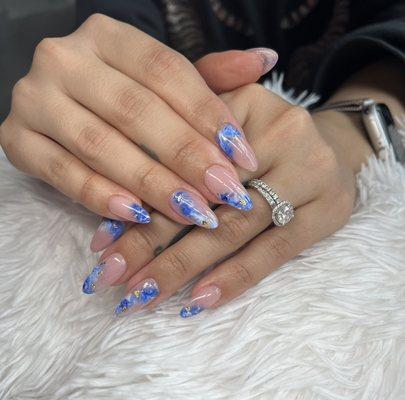 Gel x après nails with blue marble nail art; Nail artist located in Miami, FL.