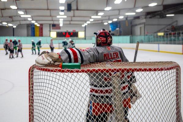 Deerfield Hockey goalie takes a quick breather during the break