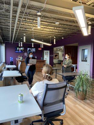 A sunny and airy Open Co working area with a Complimentary coffee Teas, Seltzers and Kombucha area