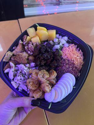 A build your own salad with shrimp steak and chicken