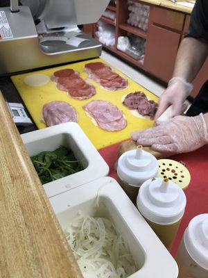 Freshly Cutting the Meat and Bread