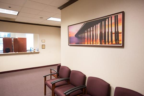 "Pier Ablaze" in a Framed canvas 24"x72" adds beauty to the waiting room of a dentist's office.