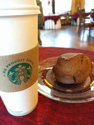 Coffee and cinnamon muffin, elegant dish and real silverware to use. Very casual classy.