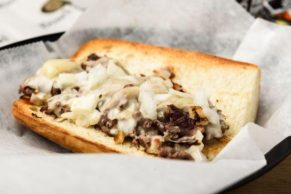 The A Train: Hot Roast Beef, Sauteed Onions, Jalapeño Pepper Jack Cheese on a toasted Italian Hero Roll