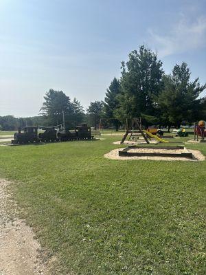 Kids playground and sand volleyball is in the back