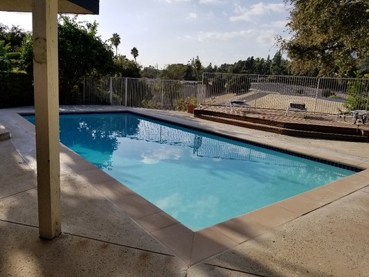 Pool.  Simple design.  Pool set at an angle in our backyard.