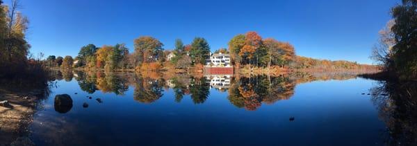 Love the autumn view by the river! There are ducks too.