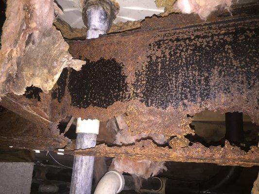 rusted mobile home I-beam caused by a leak.