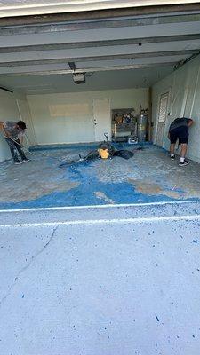 Here we were removing all the old paint from the garage floor.