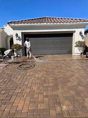 Exterior repaint + pavers seal coat.