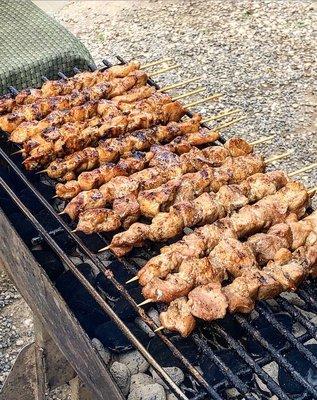 Chicken or pork bbq sticks. They are $3 and cash only.