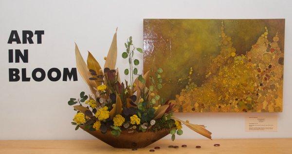 A painting and floral arrangement from our annual Art in Bloom fundraiser.