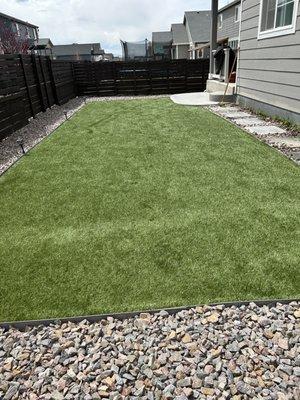 Artificial turf, rock and pavers