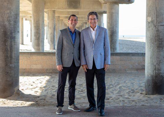 Huntington Beach Real Estate Agents Justin Ratowsky and Craig Ratowsky from the Ratowsky Group at Compass at the Huntington Beach Pier.