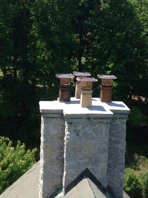 This chimney had 4 copper caps installed and the surface had Crown  Coat installed which comes with a 15 year warranty.