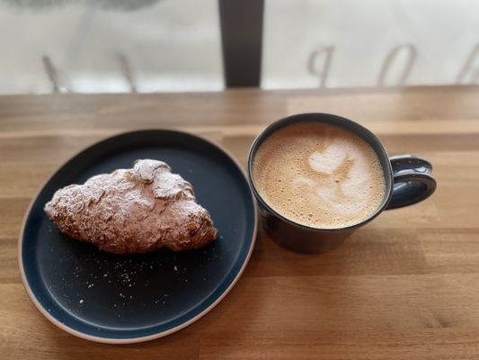 Almond croissant and oat milk latte