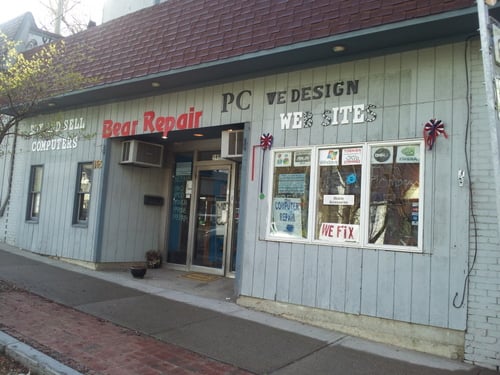 Another view of storefront with on street parking