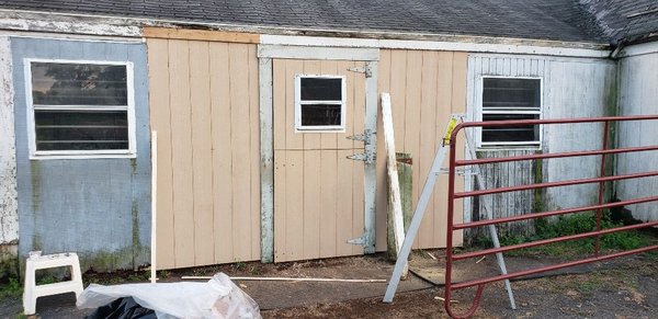 Horse barn with restructured wall and rot replaced.