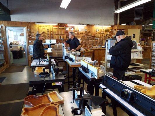 The Eagle America Showroom and Outlet Store: one of our woodworking experts multi-tasking to help customers!