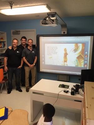 Dreams to Life founders next to the smart board they facilitated and setup.