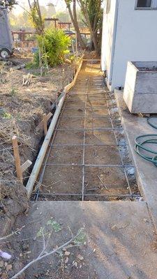 This shows the framing and the rebar for the drainage ditch. I was delighted with their work. Top quality workmanship.